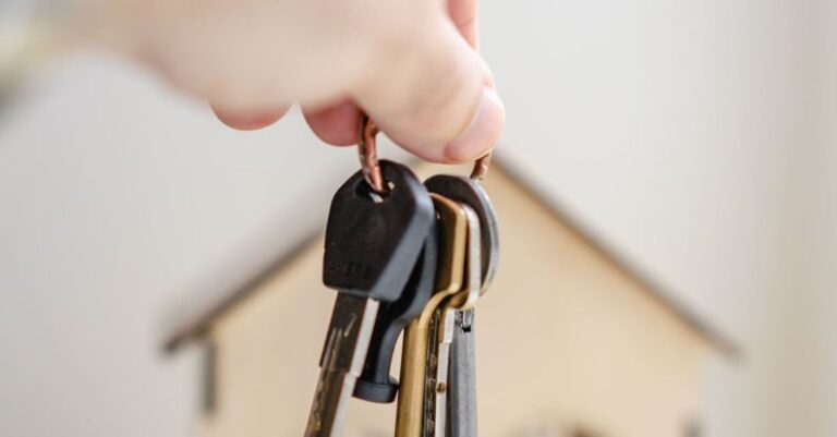 FHA Loans - Person with keys for real estate