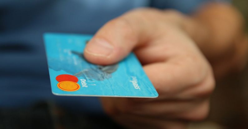 Payments - Person Holding Debit Card