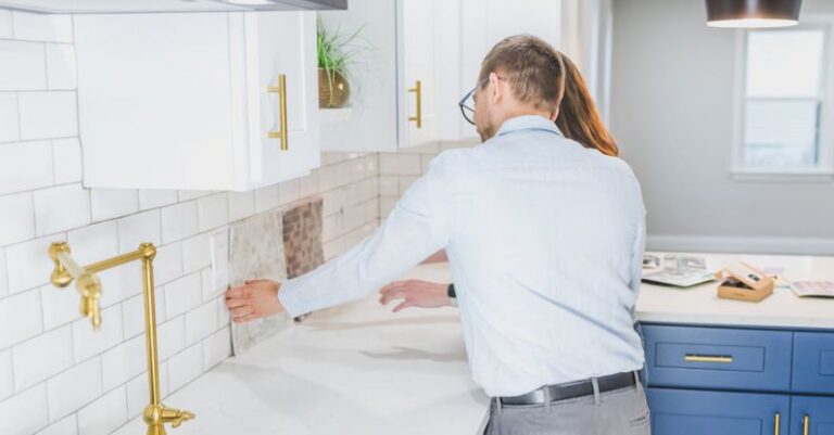 Comparable Sales - Real Estate Agents Checking the Tiles in the Kitchen