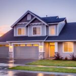 Property - Blue and Gray Concrete House With Attic during Twilight