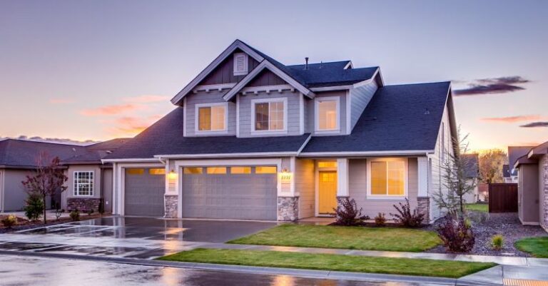 Property - Blue and Gray Concrete House With Attic during Twilight