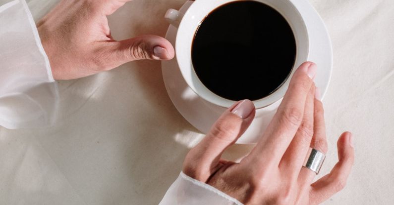 Refinance - Person Holding White Ceramic Mug With Black Liquid