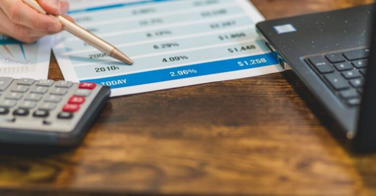 Rates - A Close-Up Shot of an Agent Pointing Rates with a Ballpen